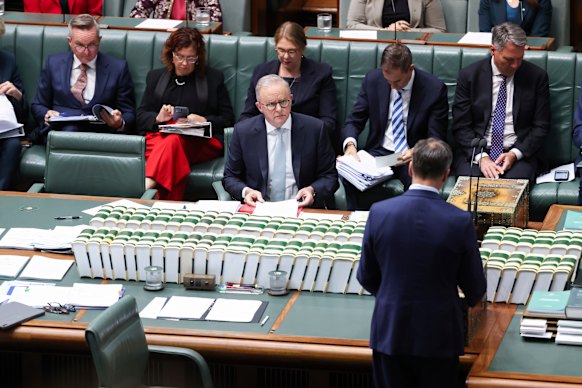 The opposition leader standing to ask his question.