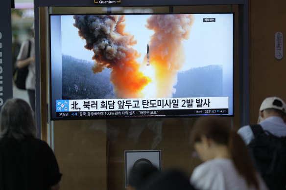 A TV screen shows a report about North Korea’s ballistic missiles at a train station in Seoul, South Korea.