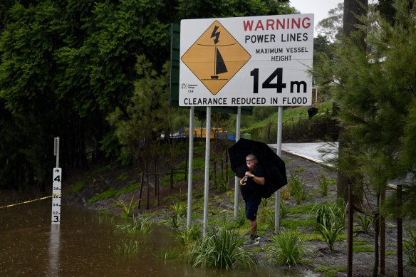 Windsor residents head down to inspect the Hawkesbury River on the rise.