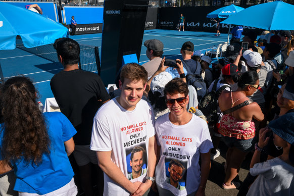 Medvedev supporters Julie Ferguson and son Jack at Medvedev training session on day 1 of Australian Open.
