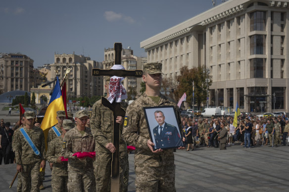 People pay their respects on Monday to colonel Serhiy Ilnitsky, a Kyiv City counsellor and deputy head of the Ukrainian Volunteer Army who was killed in battle with Russian troops.