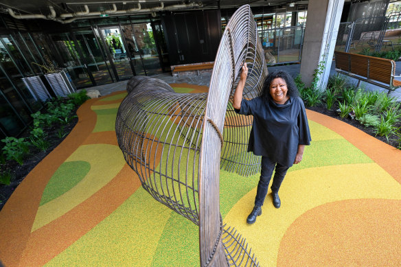 Maree Clarke with her eel-trap sculpture, one of the First Nations artworks at narrm ngarrgu Library and Family Services.