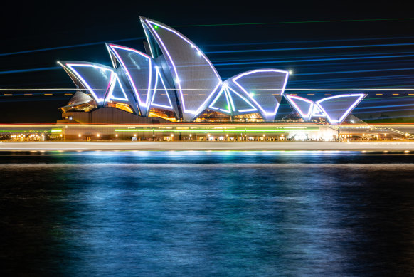 The sails of the Opera House illuminated with lasers on Friday night to celebrate the building’s 50th anniversary.