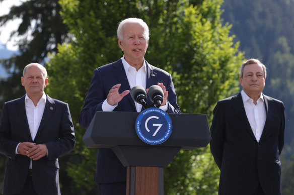 President Joe Biden speaks at a G7 side event in Germany alongside German Chancellor Olaf Schulz and Prime Minister of Italy Mario Draghi 