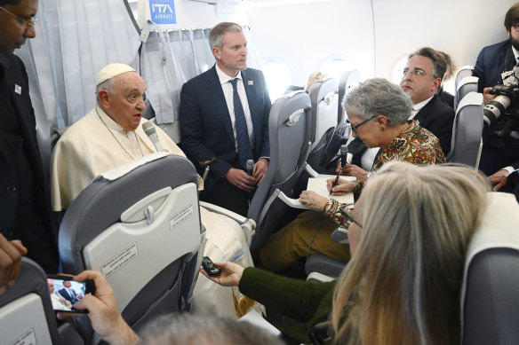 Pope Francis with journalists during a press conference aboard the airplane directed to Rome.