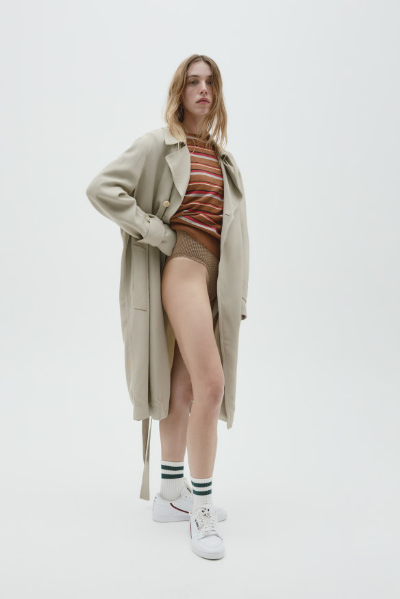 Bassike trench coat, $1250. Oroton sweater, $299. Bond-eye swimsuit, $175. Adidas Originals “Continental 80” sneakers, $160, from The Iconic. Stylist’s own socks.
