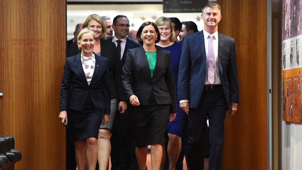 New LNP leader Deb Frecklington (centre) and her new deputy Tim Mander (right) walking in to the party room meeting that saw their elevations.