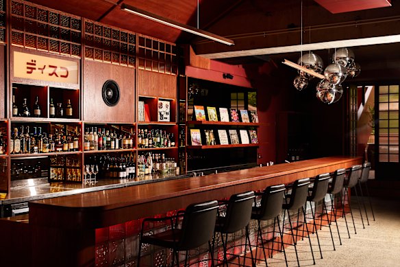 Upon entering the revamped bar, a cluster of disco balls speaks to the all-vinyl soundtrack.