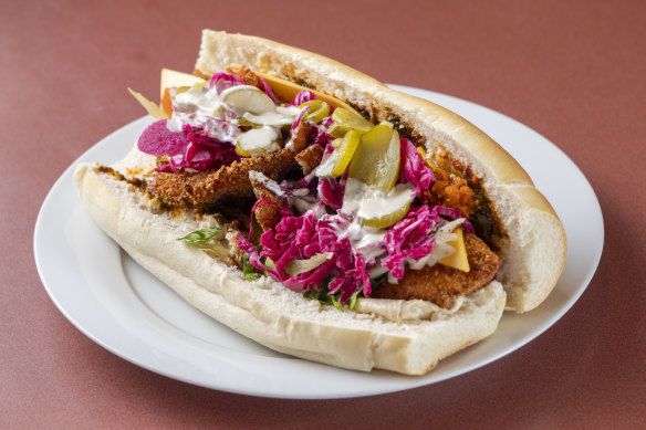 The garlic and paprika schnitzel with Moroccan-spiced carrots, pickled red cabbage, pickles, cheese and more at Marko’s Schnitzel.