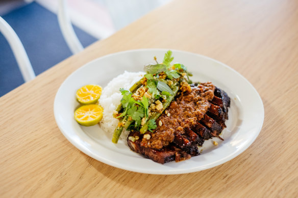 Indonesian roast beef with peanut sauce, snake bean and coconut salad, and rice.