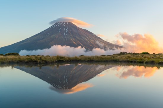 Reflection of Mount Taranaki at sunset. Egmont National Park, North Island, New Zealand. 