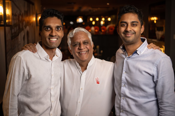 Kumar Mahadevan (centre) with his two sons, Aki (left) and Abhi Mahadevan (right).