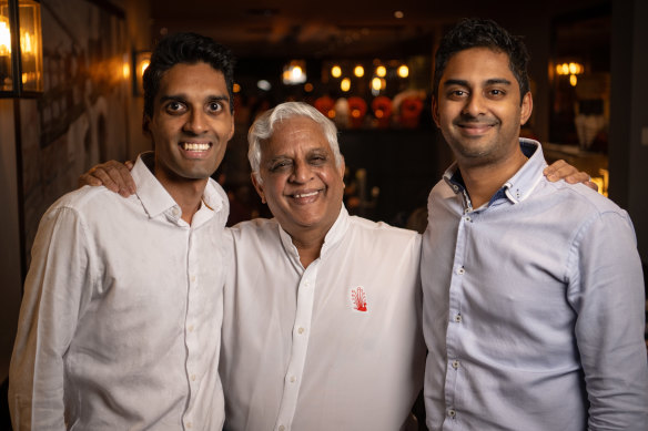 Kumar Mahadevan (centre) with his two sons, Aki (left) and Abhi Mahadevan (right).