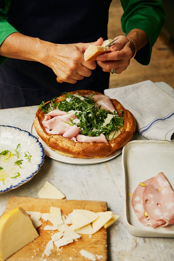 Add dressed rocket leaves and parmesan shavings.