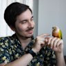 Schuster and Connie, a green-cheeked parrot he rescued from his first job as a vet.