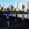 Joggers and walkers along the Farm Cove seawall. 