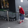 A woman enters Maroubra Woolworths in Sydney on Monday 16 March, 2020.