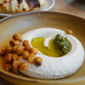 Hummus with crispy chickpeas and green chilli.