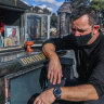 Spiros Dimitriou at his father’s grave in 2020.