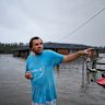 James Larking, 54, at his flooded home in Pampoolah. 