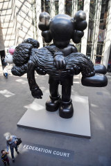 The seven-metre tall sculpture, GONE, by Brian Donnelly in his show KAWS at the NGV.