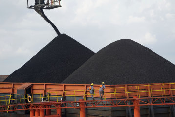 Coal is loaded onto a barge in Kutai Kartanegara, East Kalimantan.
