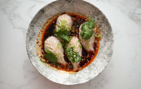 Chicken and ginger dumplings with black vinegar, garlic and shallot.