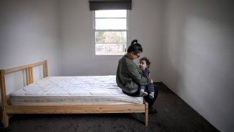 Micaela and daughter Harper in a bedroom of their Heidelberg West rental home.