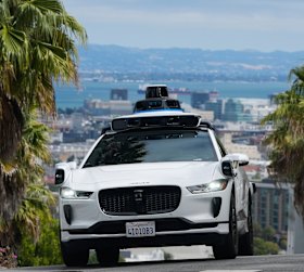 A Waymo taxi drives in San Francisco. 