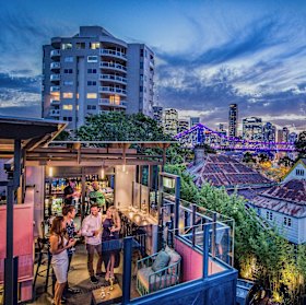 In the distance, the rooftop bar where Story Bridge stood was glowing purple.