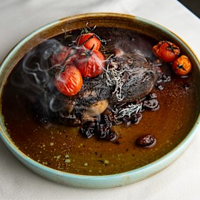 The lamb arrived with a sprig of burning rosemary.