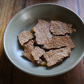 Cured kingfish with lemonade fruit, oats and isot chili.