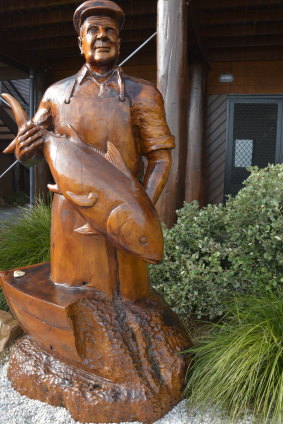A carving of fishing icon Carmillo 'Poppy' Puglisi at the Bermagui Fisherman’s Wharf.