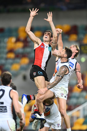 St Kilda's Max King flies for a mark.