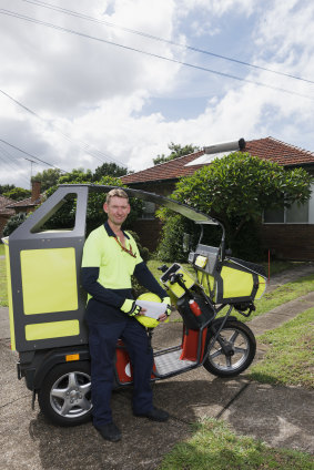 David Archer at work delivering the mail while trialling a new electric buggy.