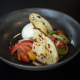 Marrickville Burrata with vine ripened tomato, sourdough wafer, aged balsamic and basil.