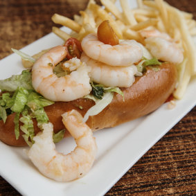 Marinated prawn roll with avocado and fine  pencil-tipped fries.