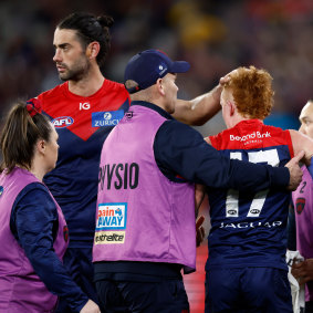 Jake Bowey is attended by medical staff.