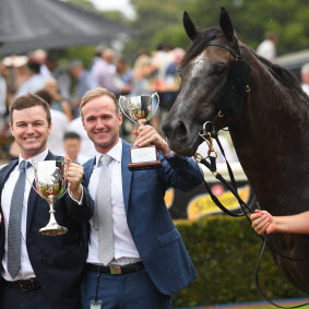 Trainers Ben Hayes and JD Hayes with Little Brose after the win.