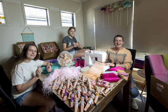 The fourth generation in the Stott family is now involved in doll season, spending months making clothes and dressing cupie dolls. Lauren Stott (right) is pictured with daughters Indy, 14, and Tyler, 12.