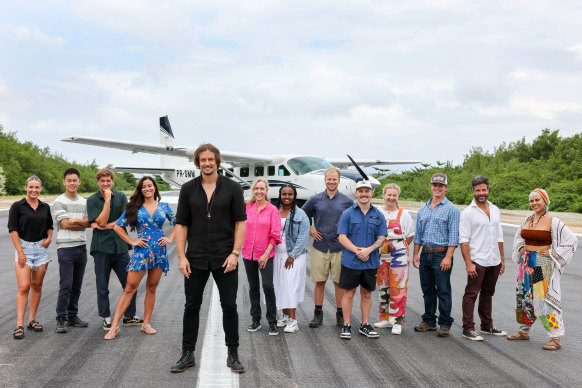 Presenter David Genat (forefront, in black) and the contestants in Rush.