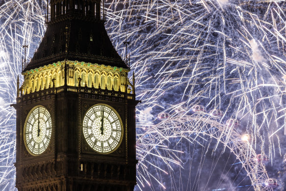 Fireworks light up the London skyline over Big Ben and the London Eye just after midnight on January 1, 2023 in England. 