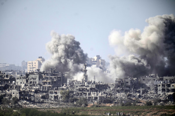 A plume of smoke follows an Israeli airstrike in the northern part of the Gaza Strip as Israel continues its bombardment and ground offensive seen from Sderot, Israel.