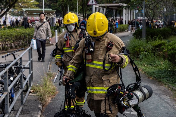 Firefighters in the Tai Po district on Thursday.