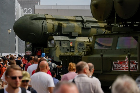 Visitors walk past exhibits, including a Russian mobile Topol missile launching unit, at the international Army-2023 forum near Moscow on Friday.
