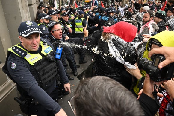 Police deploy pepper spray during a pro-Palestinian rally on Sunday.