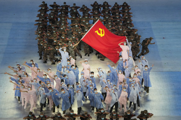 Performers dressed as first responders in the fight against the COVID-19 pandemic take part in a gala show ahead of the 100th anniversary.