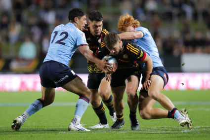 Alex Nankivell tries to punch a hole in the Waratahs’ defence.