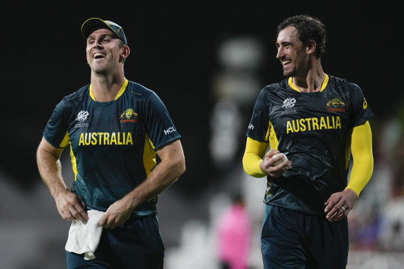 Starc (right) with Australia’s captain Mitch Marsh during the recent clash with Oman.