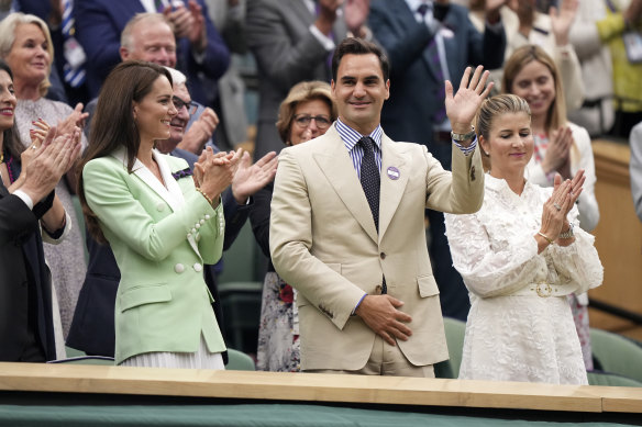 Roger Federer, in the Royal Box next to Britain’s Kate Princess of Wales, is applauded at Centre Court.